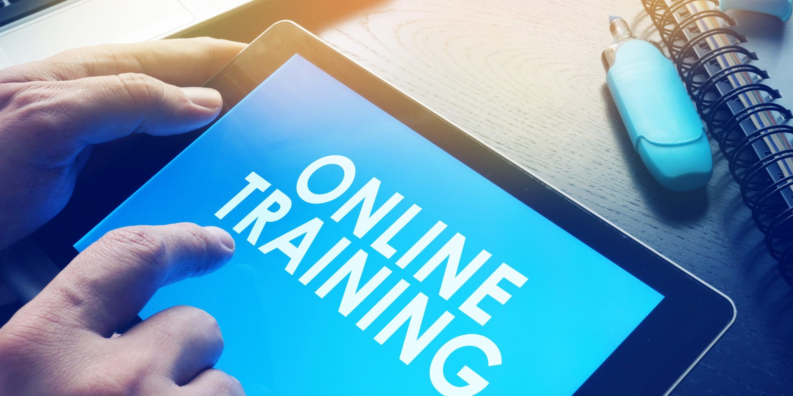 E-learning concept. Online training on a screen of tablet.